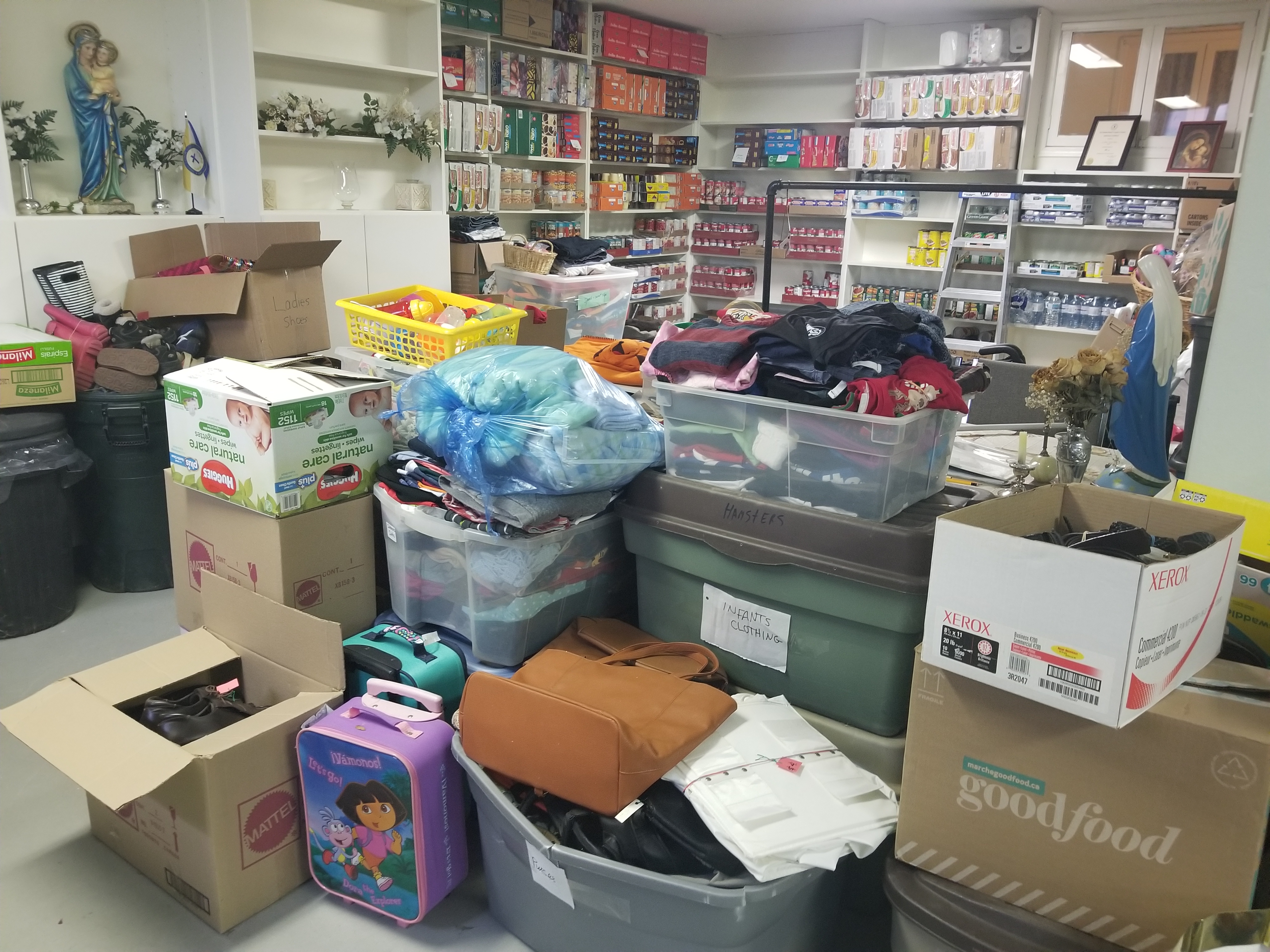 Shoes and school supplies for donation at church basement
